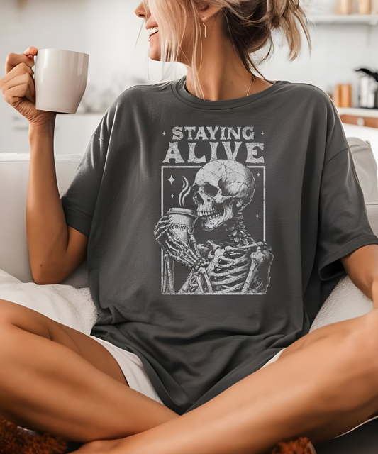 "Staying Alive" Skeleton Coffee Comfort Colors T-Shirt | Halloween Graphic Tee | Vintage Unisex Shirt Dark